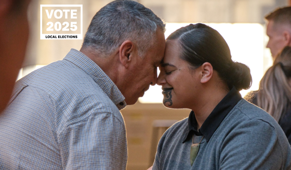 A woman with tā moko and a man hongi, with "Vote 2025 Local Elections" in the corner