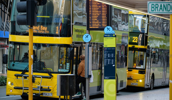 Two double decker buses at a bus stop in the Wellington CBD