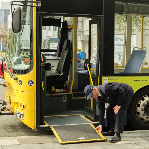 A driver lowering the ramp on a bus