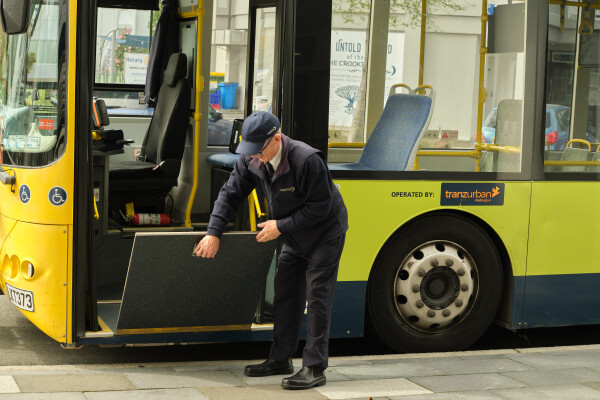 A driver lowering the ramp on a bus