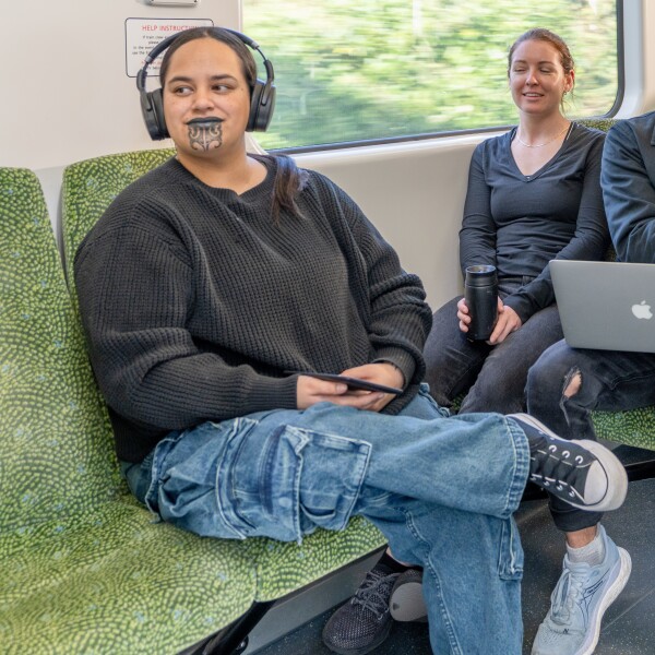 A woman sitting on a train