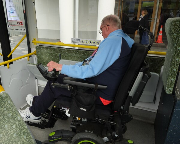 Person in a wheelchair on a bus