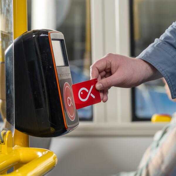 A hand holding a Snapper card to the reader
