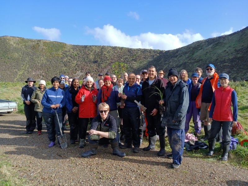 A crowd of volunteers at the Baring Head/Ōrua-pouanui planting day